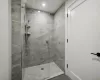 Bathroom featuring tiled shower