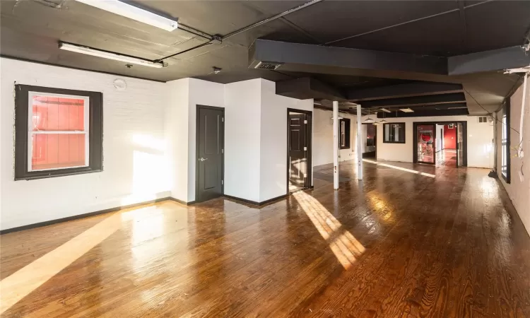 Unfurnished room featuring hardwood / wood-style floors