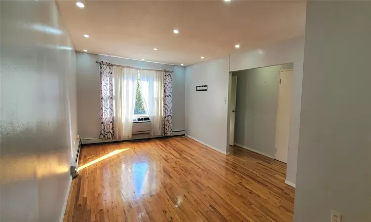 Empty room with light wood-type flooring