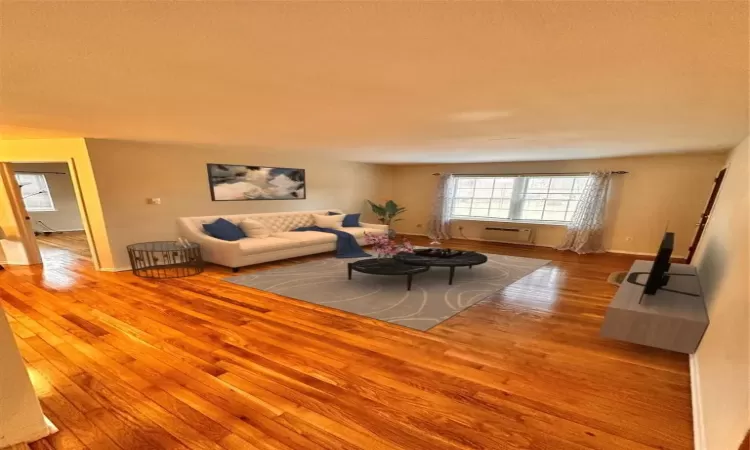 Virtually Staged Living room featuring light hardwood / wood-style floors