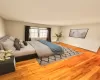 Virtually Staged Bedroom with wood-type flooring