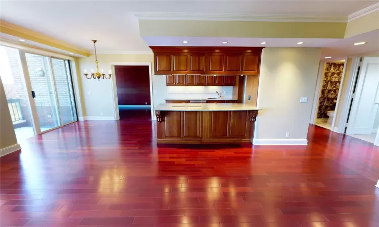 View of Open Concept Living with, View of Kitchen, Overlooking Wall of Windows, Entry to Balcony, Room Featuring Crown Molding and Dark Hardwood   Flooring