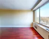 View of Living Room with Wall of Window and Balcony Access