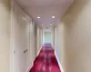 Majestic Entry Hallway featuring dark hardwood / wood-style floors and ornamental molding, Guest Closet, Guest Powder Room, Utility Closet, Laundry Room