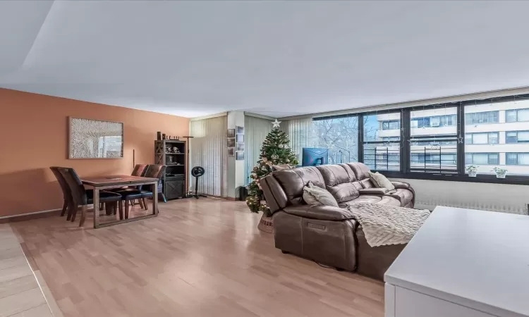 Living room featuring light hardwood / wood-style flooring and expansive windows