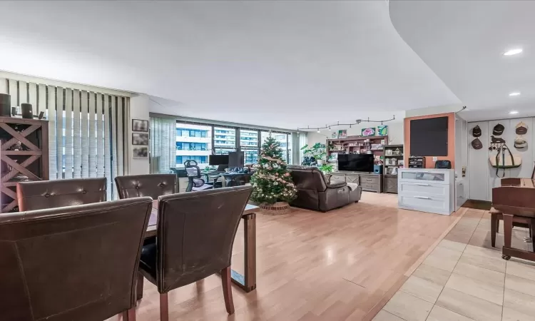 Dining area with light hardwood / wood-style flooring