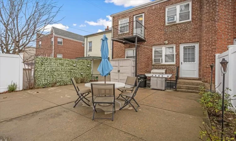 View of patio / terrace featuring grilling area and a balcony