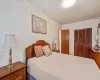 Bedroom featuring a textured ceiling and a closet