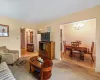 Living room featuring carpet flooring and a chandelier