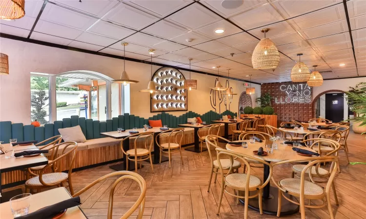 Dining space with light parquet floors