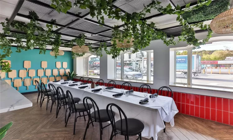 Dining area with dark parquet flooring