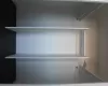 View of spacious closet inside bedroom