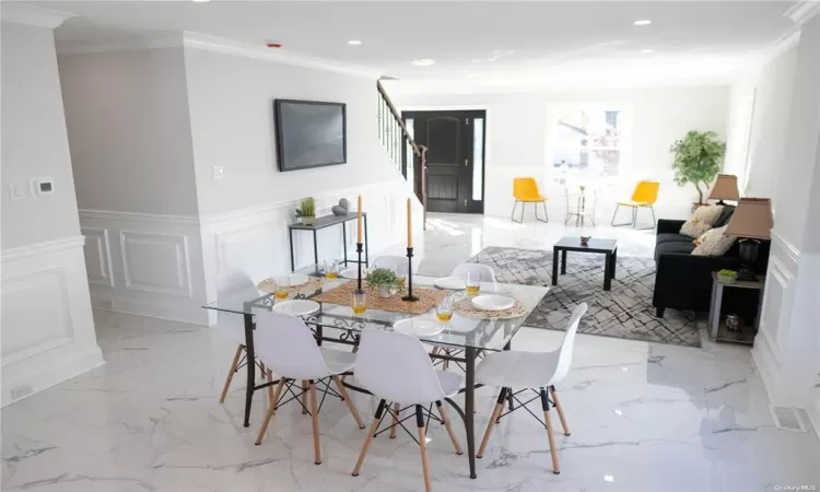 Dining area with ornamental molding