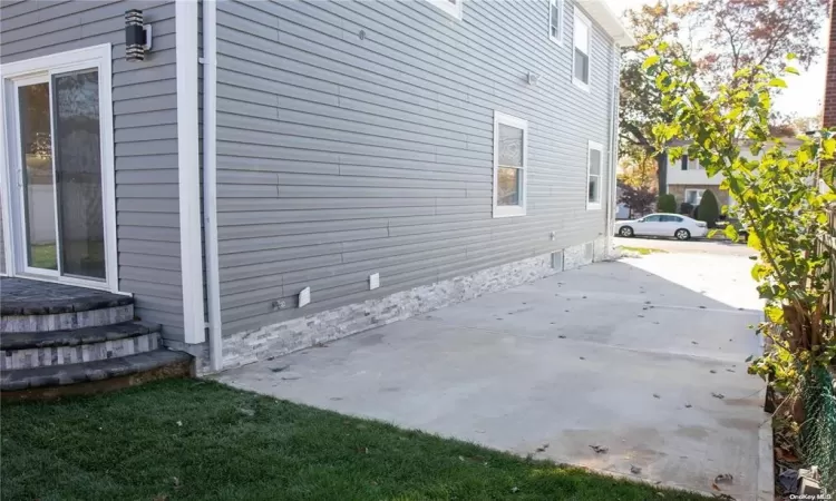 View of property exterior with a patio