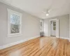 Primary Bedroom with light hardwood / wood-style flooring, radiator, ornamental molding, and ceiling fan