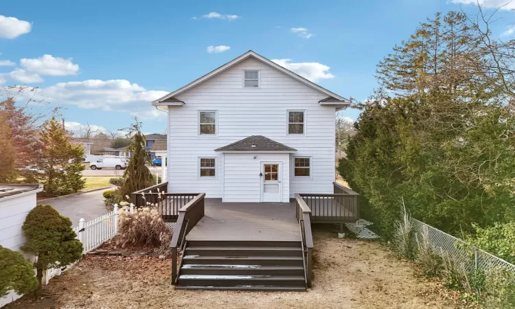 Back of house featuring a deck