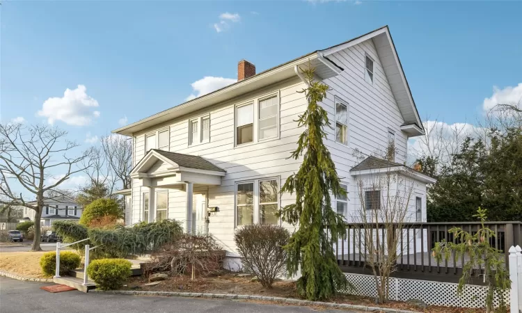 View of front of home featuring a wooden deck