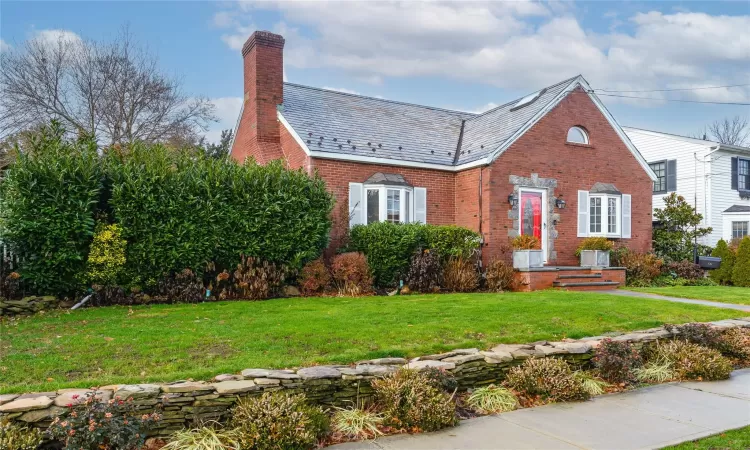 View of front of house with a front yard