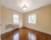 Bedroom featuring crown molding and hardwood floors