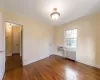 Bedroom featuring crown molding and hardwood floors