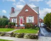 View of front of house featuring front yard and driveway