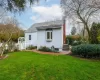 Back of house with fenced yard