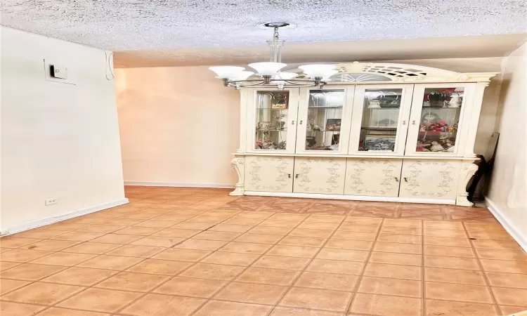 Foyer /dining area with light tile patterned floors