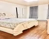 Main Bedroom featuring hardwood floors, 2 Closets and 2 Windows