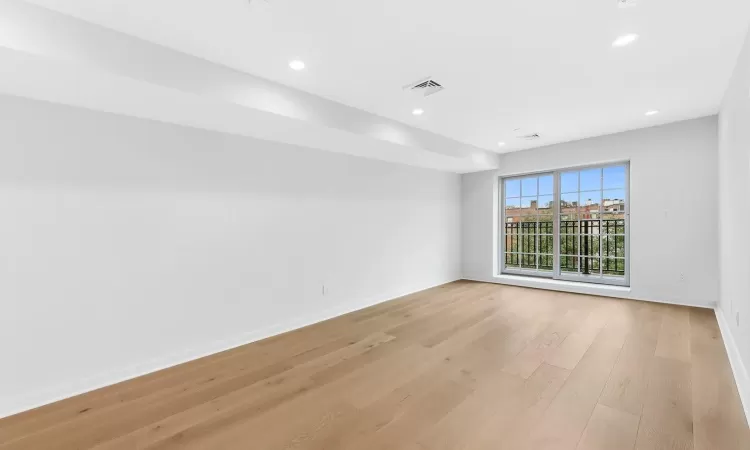 Spare room featuring light hardwood / wood-style flooring