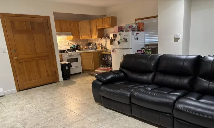 Tiled living room featuring sink