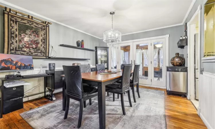 Living room featuring hardwood / wood-style floors and a chandelier