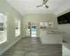 Kitchen with white cabinets, ceiling fan, lofted ceiling, and sink. FOR MARKETING PURPOSES ONLY.