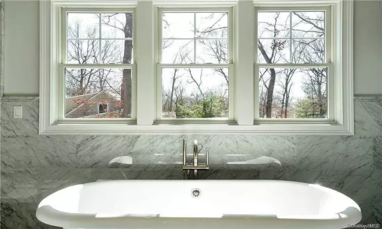 Bathroom featuring a washtub. FOR MARKETING PURPOSES ONLY.