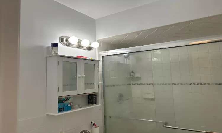 Bathroom with a shower with door