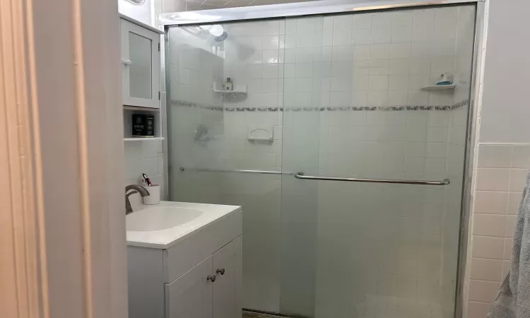 Bathroom featuring vanity and walk in shower