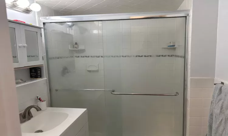 Bathroom featuring vanity and walk in shower