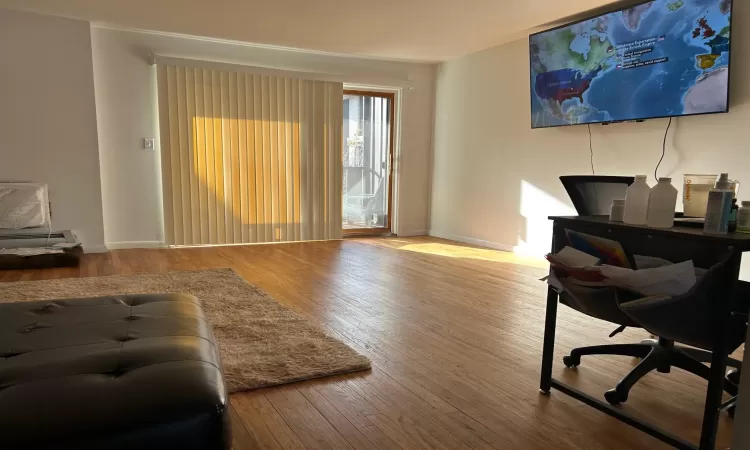 Living room with hardwood / wood-style floors