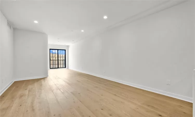 Empty room featuring light hardwood / wood-style flooring