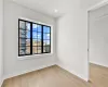 Unfurnished room featuring light wood-type flooring