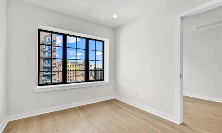 Unfurnished room featuring light wood-type flooring