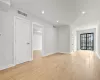 Unfurnished room with light hardwood / wood-style floors