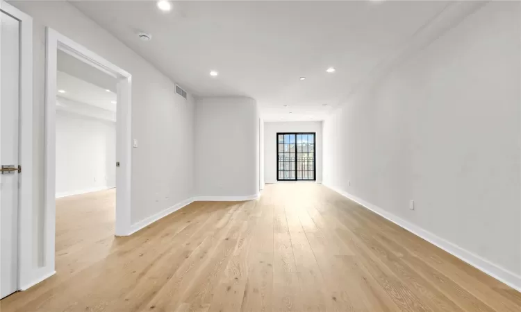 Spare room featuring light wood-type flooring