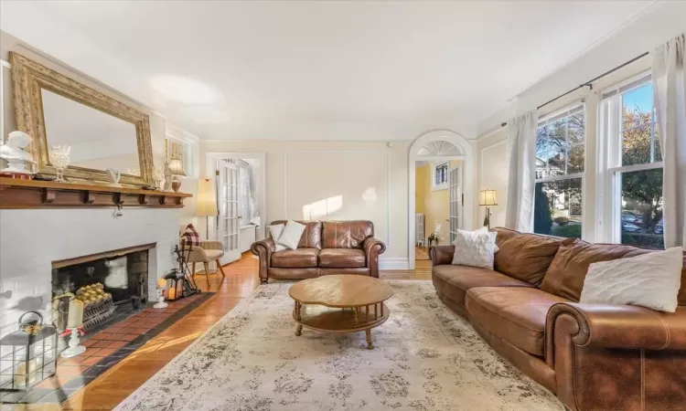 Living room featuring a fireplace and hardwood / wood-style flooring