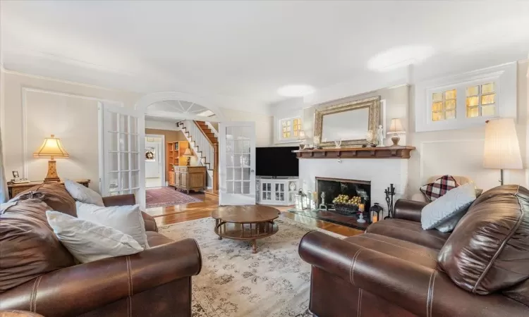 Living room featuring hardwood / wood-style floors and french doors