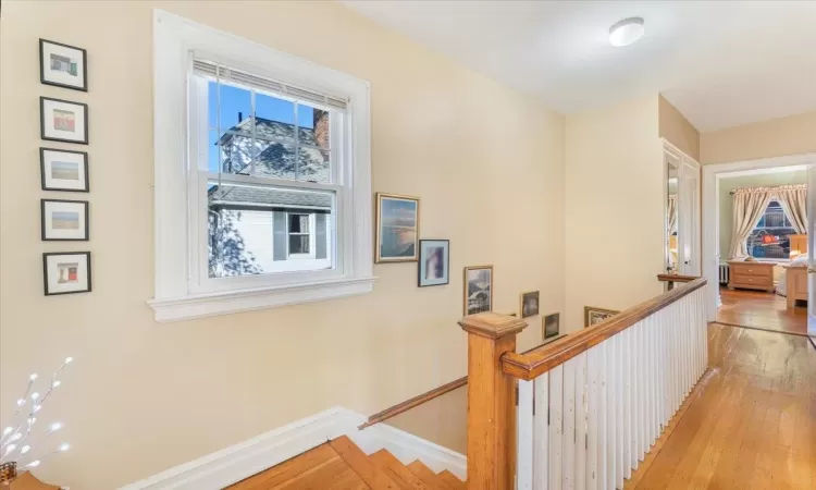 Hall with light hardwood / wood-style flooring