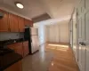 Kitchen with stainless steel refrigerator, sink, and light hardwood / wood-style floors