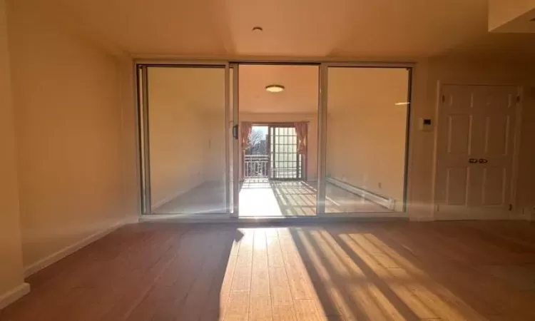 Spare room featuring hardwood / wood-style flooring