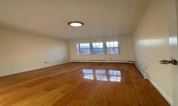 Spare room featuring hardwood / wood-style floors