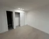 Unfurnished bedroom with a closet and light hardwood / wood-style floors