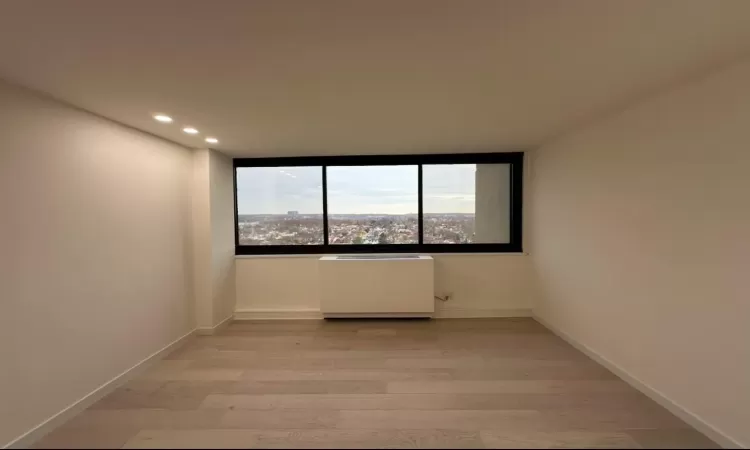 Unfurnished room with light hardwood / wood-style floors